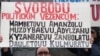 Пикет казахских беженцев в Праге. На плакате написано "Казахстан председательствует в ОБСЕ в 2010 году. ПОЗОР". Февраль 2009 года.