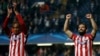 U.K. -- Atletico Madrid's Arda Turan (R) and Miranda celebrate at the end of their team's Champions League semi-final second leg soccer match against Chelsea at Stamford Bridge Stadium in London, April 30, 2014