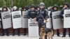 Kazakhstan - Shymkent - mother Laura KalyRiot police officers keep watch on opposition supporters during a rally - Kazakhstan protest in Nur-Sultan on June 9, 2019 - the day of Kazakhstan's presidential elections. (Photo by VYACHESLAV OSELEDKO / AFP)