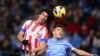 Spain -- Atletico Madrid's Arda Turan (L) vies with Celta's defender Hugo Mallo (R) during the Spanish League football match Atletico de Madrid vs Celta de Vigo at Vicente Calderon stadium in Madrid, 21Dec2012